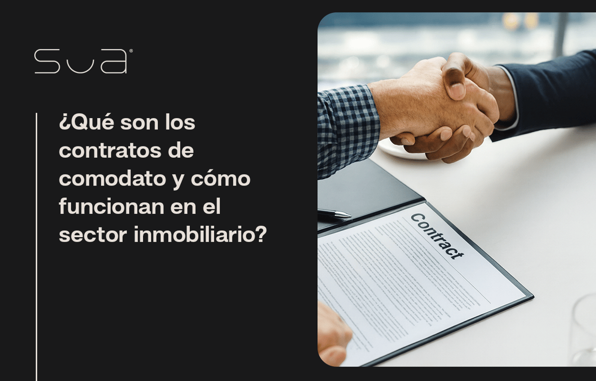 Dos personas dándose un apretón de manos frente a un contrato de comodato de inmueble, con documentos legales sobre la mesa
